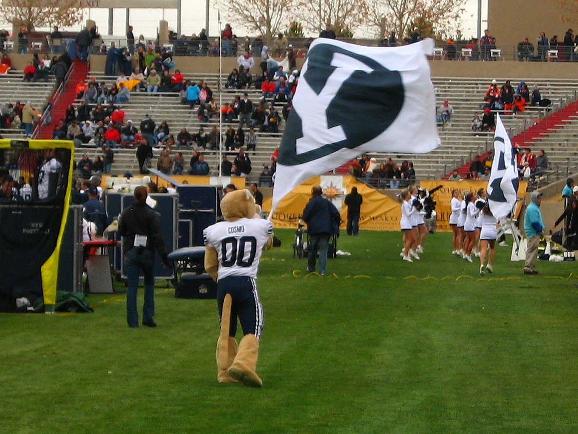 Cosmo the Cougar waving the BYU flag